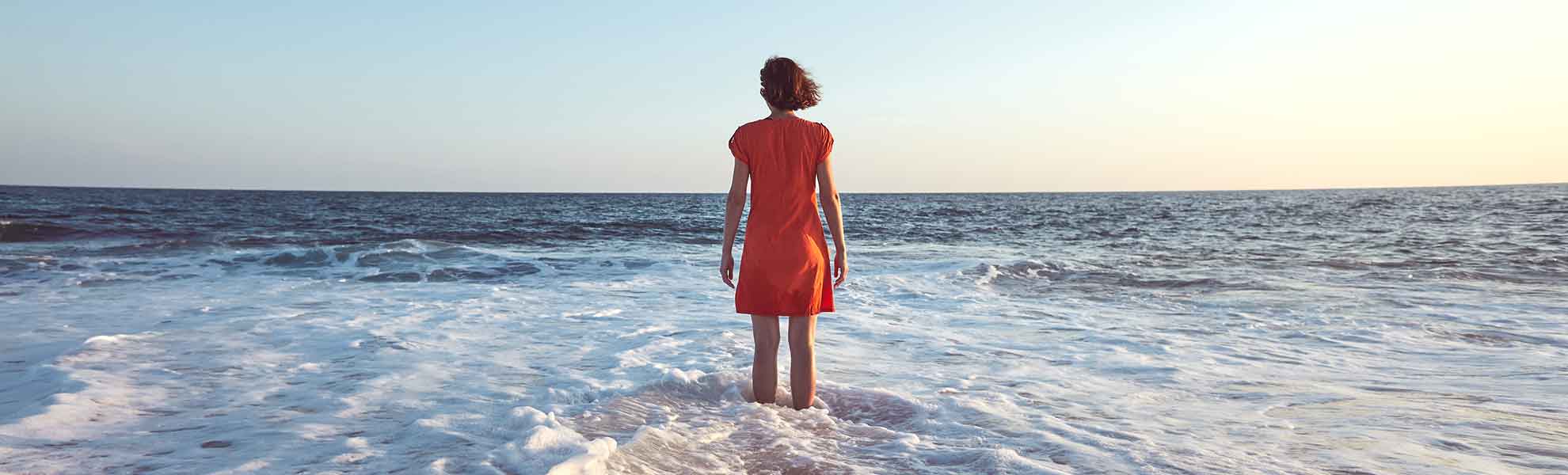 lady standing in the sea - women health services